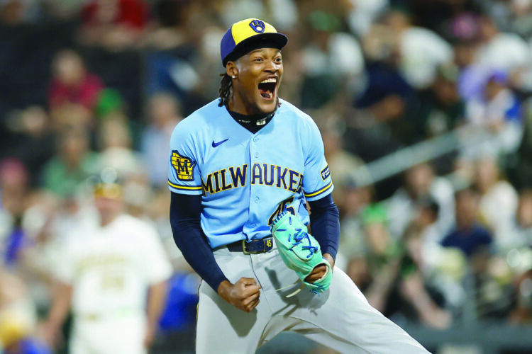 Brewers outlast A's 15-14 in 12 innings as teams combine for 11 homers and 34 hits in Las Vegas